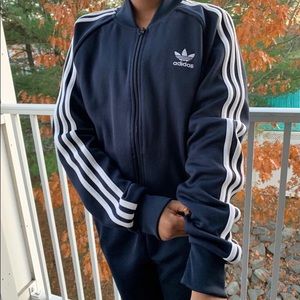 Dark blue adidas track jacket.